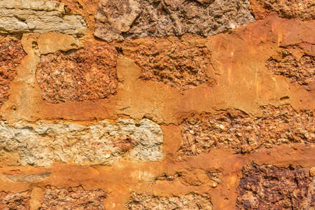 Stone texture of old ancient brick wall in sunny day. Modern luxury background for design with space...