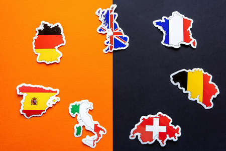 Maps of Great Britain, France, Germany, Italy, Spain, Belgium, Switzerland with flags on double black and orange background. Stop coronavirus in Europe. Covid-19 outbreak, pandemic concept.の写真素材