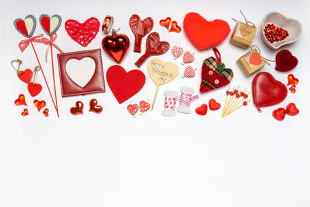 Various hearts and stylish accessories in heart shape, gifts and sweets in red color on white background. Empty photoframe, mock up. Greeting card for Valentine's day, love and romance concept.の写真素材