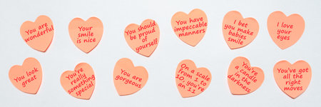 Happy World or National Compliment Day. Pink paper stickers in heart shape with text of popular...