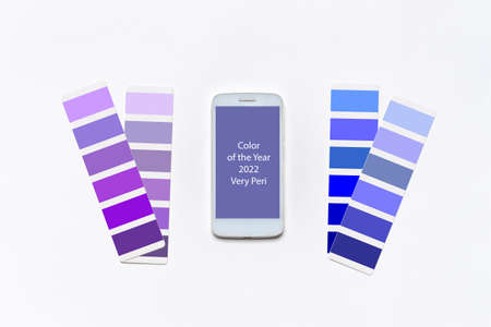 Color of the year 2022 very peri. Violet and blue swatches, smartphone screen with very peri color background. Fashionable color. Main color trend of 2022 year.の写真素材