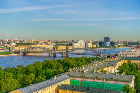 View from bell tower of Smolny Cathedral to historic center of Saint-Petersburg and Bolsheokinsky bridge in sunny summer evening. Panoramic cityscape of St. Petersburg, Russia. Travel blog concept.の写真素材