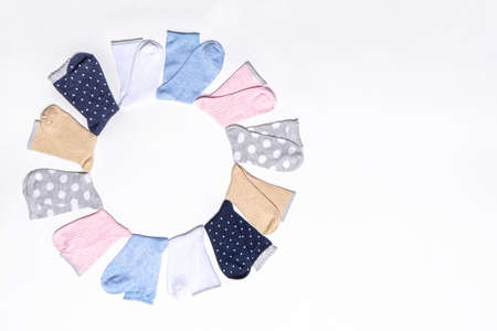 Various modern trendy women's cotton socks set on white background. fashionable socks store. Socks shopping, sale, merchandise, advertisement concept. Flat lay, top view, copy space.の写真素材