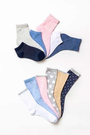 Various modern trendy women's cotton socks set on white background. fashionable socks store. Socks shopping, sale, merchandise, advertisement concept. Flat lay, top view.の写真素材