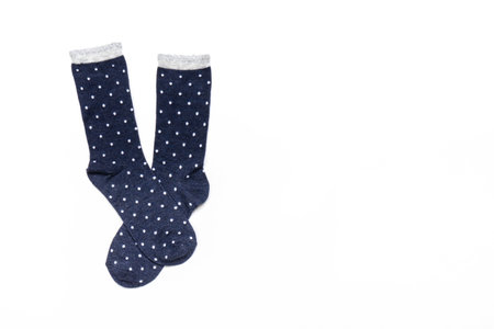 Pair of modern trendy women's cotton polka dot socks on white background. fashionable socks store. Socks shopping, sale, merchandise, advertisement concept. Flat lay, top view, copy space.の写真素材