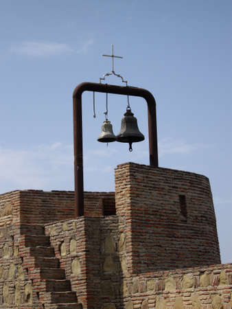 bells and cross in Narikala Fortress, castle of Tbilisi, Republic of Georgia の写真素材