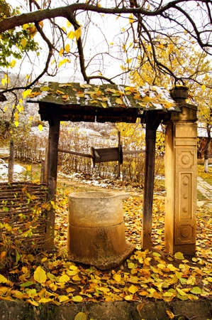 Old stone well - rural landscapeの写真素材