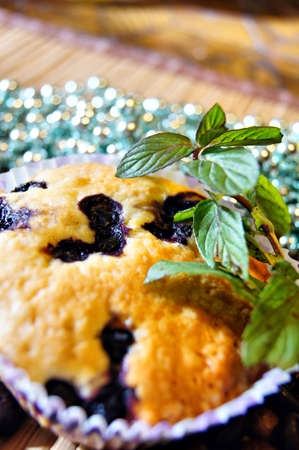 Blueberry maffin with fresh mint and christmas decorationsの写真素材