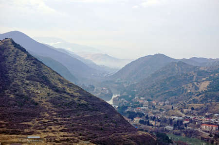 View to ancient city of Mtskheta from the Caucasus mountains         の写真素材