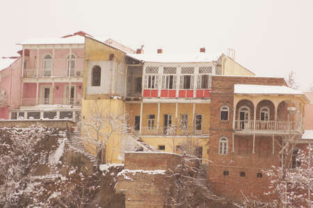 Winter view to covered with snow Tbilisi Old town in misty day