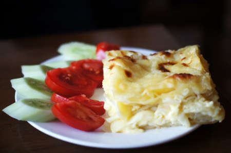Georgian dish: achma khachapuri with summer vegetablesの写真素材