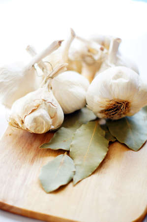 Closeup of garlic heads and bay leavesの写真素材
