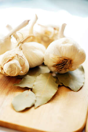 Closeup of garlic heads and bay leavesの写真素材