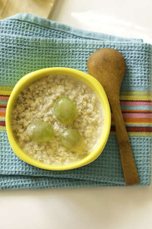Healthy breakfast made of oats and grapesの写真素材