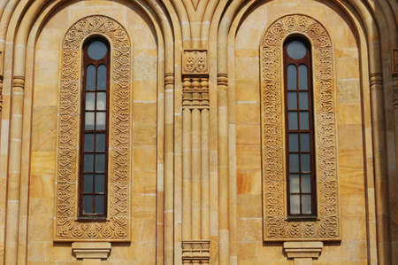 The biggest orthodox cathedral of Caucasus region - St. Trinity or Sameba cathedral in Tbilisi, Republic of Georgia - traditional georgian stone fretworkの写真素材