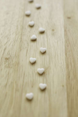 Groom and bride, rose petals and heartsの写真素材