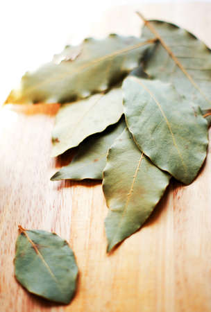 Closeup of bay leaves on the wooden desk
