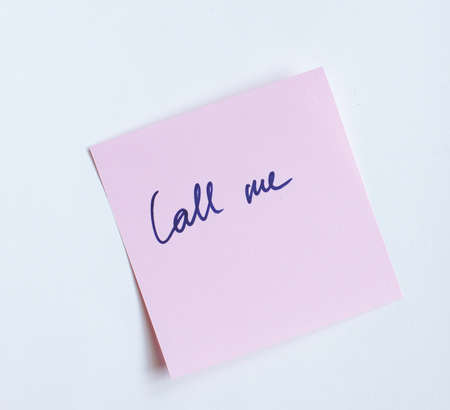 Stick paper with letters on white backgroundの写真素材