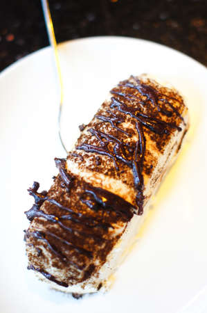 Cheesecake on the white plate on the table