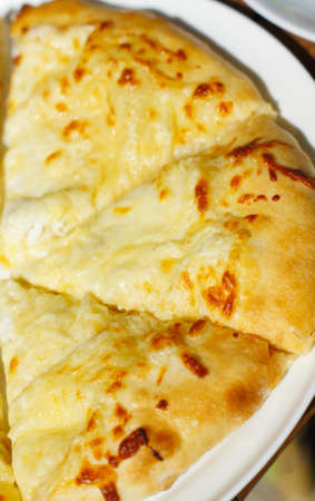 Closeup of megruli or megrelian khachapuri - famous dish of georgian cuisineの写真素材