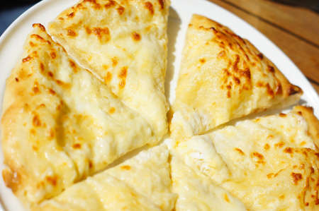 Closeup of megruli or megrelian khachapuri - famous dish of georgian cuisine