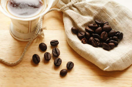 Coffee beans and Good morning note on the wooden desk