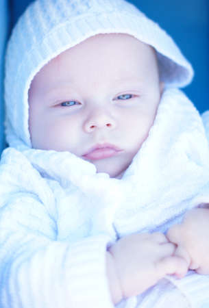 Little baby boy with blue eyes  portraitの写真素材