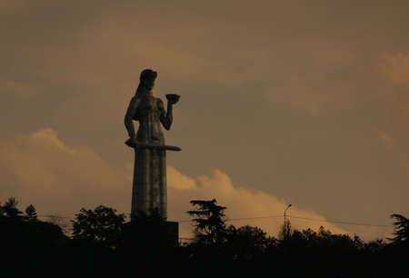 MOTHER GEORGIA, TBILISI, GEORGIA - JULY 13: Statue of Mother Georgia on July 13, 2013 in Tbilisi, Georgia. The statue loceted on 50 meters high and watches over Old Tbilisi from the Saint hill. Evening time.のeditorial素材