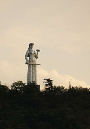 MOTHER GEORGIA, TBILISI, GEORGIA - JULY 13: Statue of Mother Georgia on July 13, 2013 in Tbilisi, Georgia. The statue loceted on 50 meters high and watches over Old Tbilisi from the Saint hill. Evening time.のeditorial素材