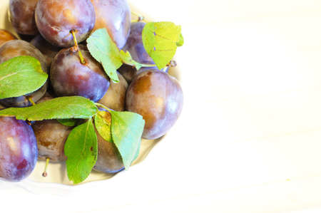 Healthy breakfast: fresh fruits of plumの写真素材