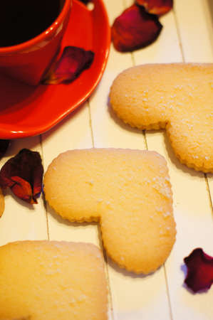Cup of coffee and heart shape cookiesの写真素材