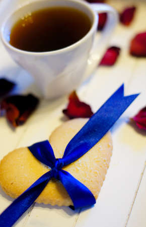 Cup of coffee and heart shape cookiesの写真素材