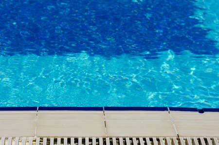 Outdoor pool in the tropical area with blue water and laderの写真素材