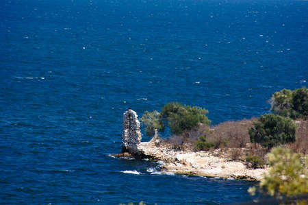 Island in Aegean sea with ancient ruinsの写真素材