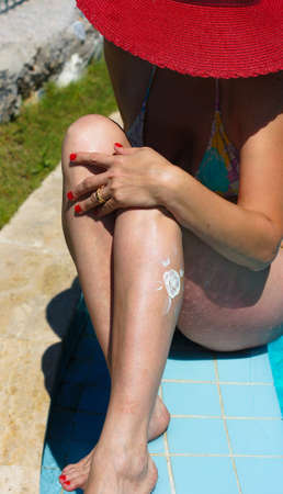 A sun made with suncream at the leg