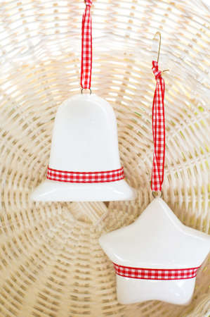 Christmas decoration - bell and star on the plateの写真素材