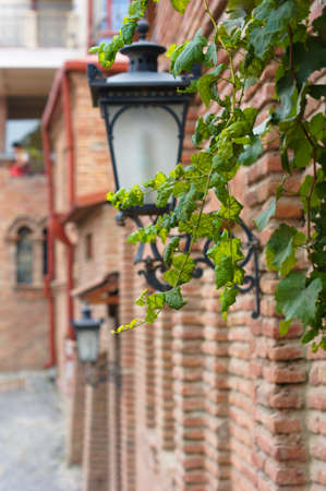 Traditional forged iron lamp on the street of Kalaubani area in Old Tbilisiの写真素材