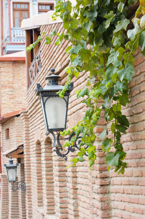 Traditional forged iron lamp on the street of Kalaubani area in Old Tbilisiの写真素材
