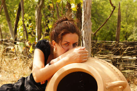 Woman relaxing in an autumn gardenの写真素材