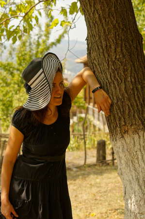 Woman relaxing in an autumn gardenの写真素材