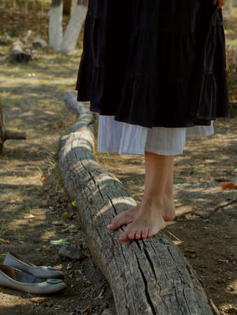 Nice woman walking on path in city parkの写真素材