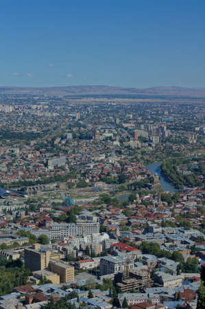 Panoramic view to Old Tbilisi from the saint Mount (Mtatsminda) with rainbow after the rain