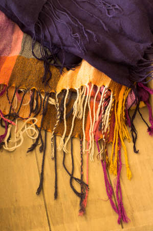 Closeup of different colors knitted scarves