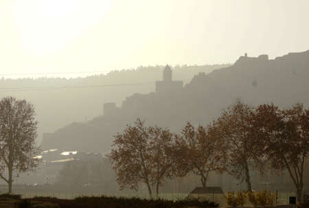 Misty morning in Old Tbilisi with view of Narikala castle and domes of ancient churchesのeditorial素材