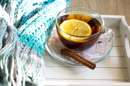 Rose-hip tea with lemon and scarf