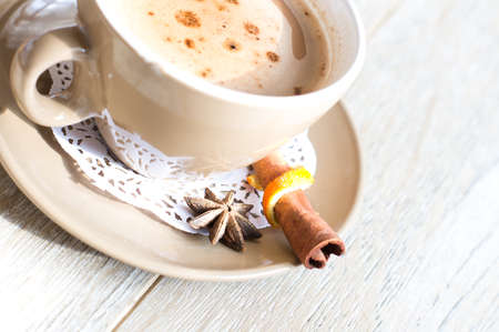 Cup of coffee with milk on the tableの写真素材