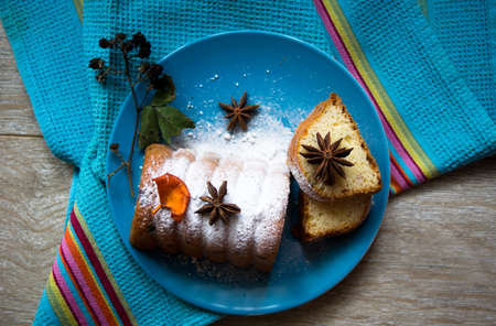 Cake with fruits and spice anise on the plateの写真素材