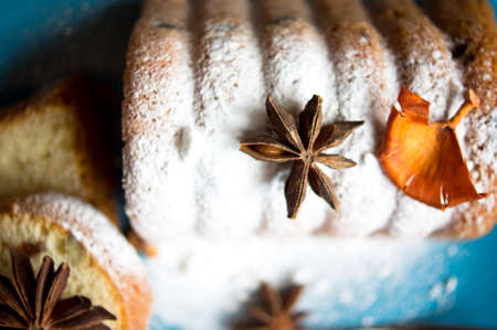 Cake with fruits and spice anise on the plate