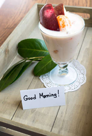 Healthy food, fresh fruits and yoghurt with Good morning noteの写真素材