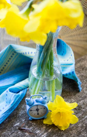Yellow daffodil flowers in vase on the windowの写真素材